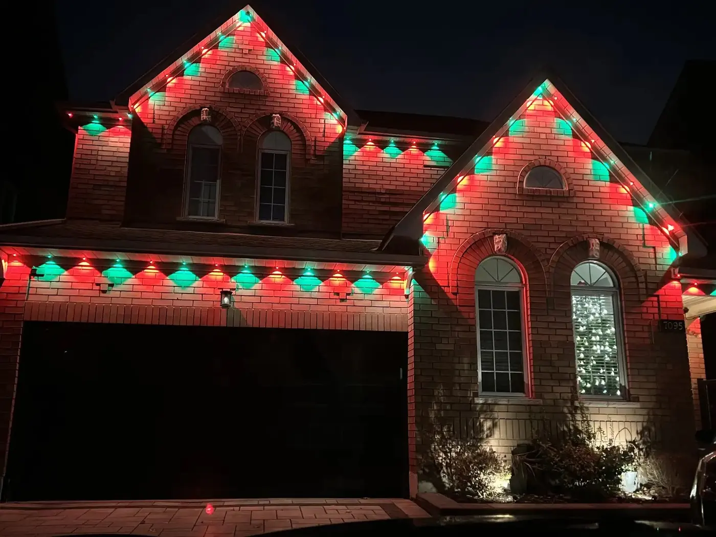 Red and green Govee outdoor lighting installation