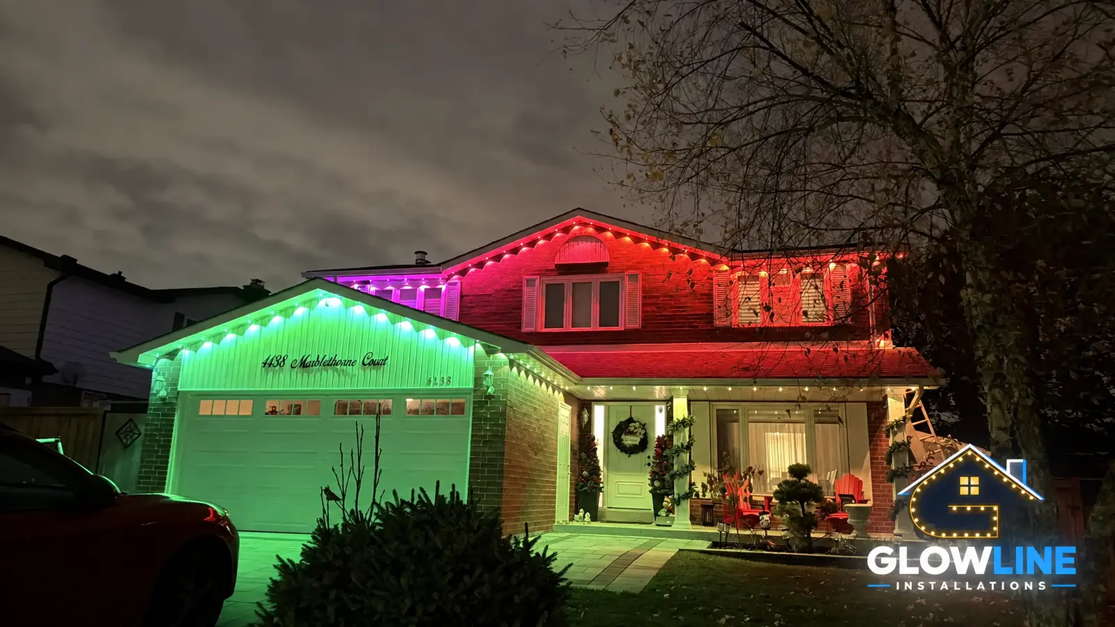 Red and green celebration lights on home
