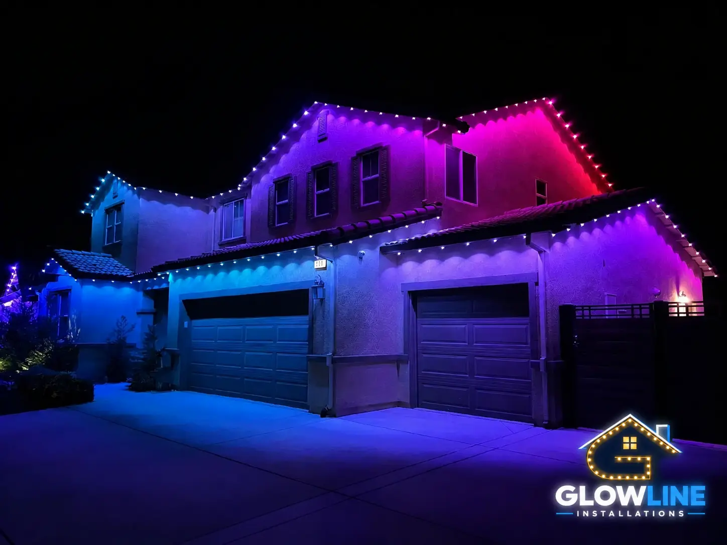 Modern home with blue and pink exterior lights